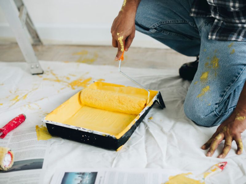 man-painting-walls-yellow (1)